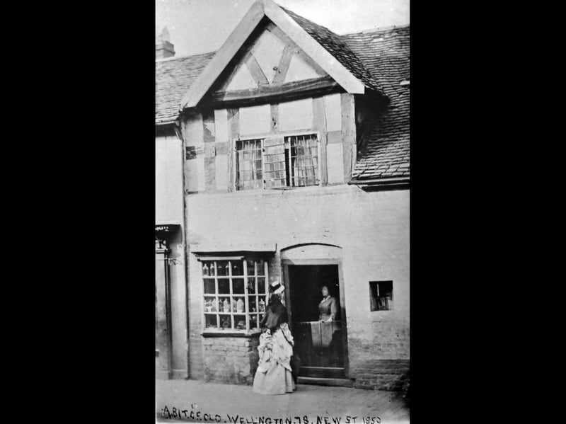Noted Wellington authoress Hesba Stretton chats to her friend Mary York. This picture was carried as a nostalgia photo in the Wellington Journal & Shrewsbury News of April 26, 1930, with the caption: ''The above illustration is of an old shop which many years ago occupied the space in New Street on which the business premises of Mr F Onions now stand. The shop when the photograph was taken was in the occupation of Miss York (a great aunt of Mr Harold York). Miss York, who figures in the doorway, is in conversation with Hesba Stretton, the Shropshire novelist, whose family name was Smith, her father at one time conducting a printing and stationery business in New Street. He was also in charge of Wellington Post Office, which in those days adjoined his premises." Written at the bottom is "A bit of old Wellington, 78 New Street, 1850," but that date is seriously in doubt as Sarah Smith - that is, Hesba - is wearing a dress which was not in fashion until significantly later.