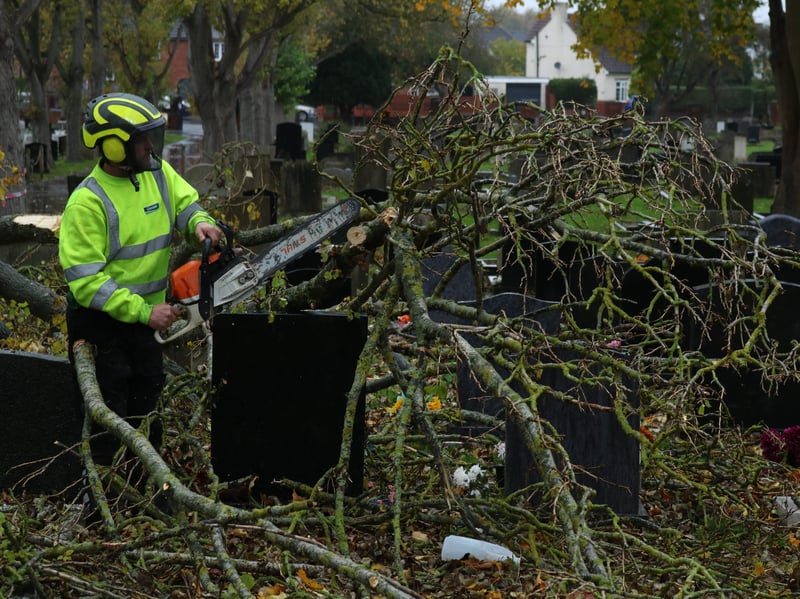 The council has begun clearing the debris and is working to secure the other tree from falling onto graves at Maltby cemetery