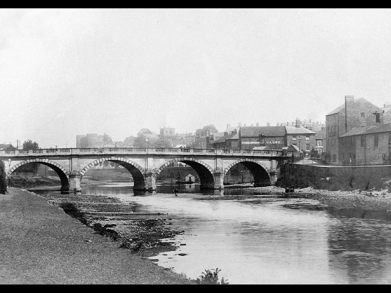 The Welsh Bridge, Shrewsbury, with Morris' old bakery on the right. The river level is very low, but we should remember that it was not until the early 20th century that Shrewsbury weir was built, stabilising levels.