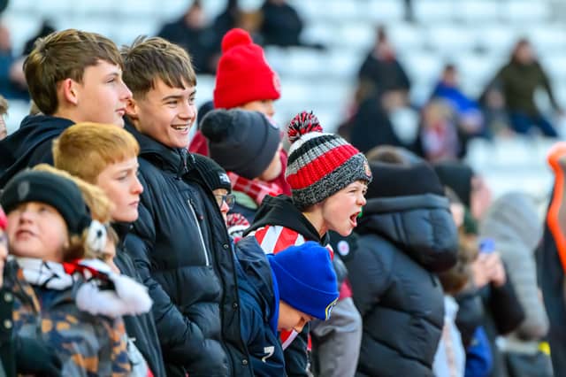 Sunderland fans in action at the Stadium of Light during the Premier League game against Leeds United. Photo by Chris Fryatt.