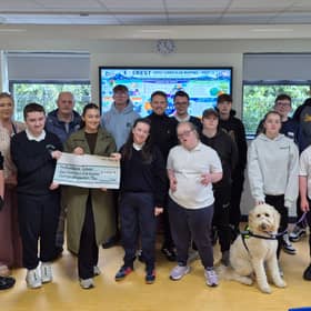 The Breslin family pictured presenting the proceeds of the 'Jog For Joe' to staff and pupils of Knockavoe School.