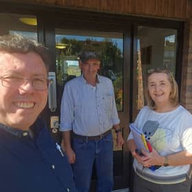 Aontú representatives Liam Reichenberg and Roisin Mulgrew with resident Peter McKeown 