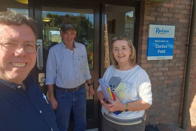 Aontú representatives Liam Reichenberg and Roisin Mulgrew with resident Peter McKeown