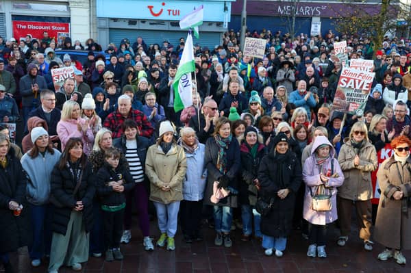 SOME of the ladies who work in Daisy Hill Maternity Ward pictured at the front of the rally in Marcus Square on Sunday. NM264367