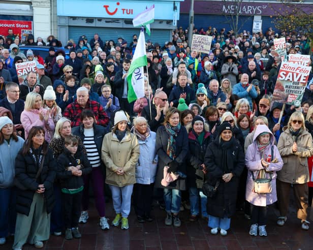 SOME of the ladies who work in Daisy Hill Maternity Ward pictured at the front of the rally in Marcus Square on Sunday. NM264367