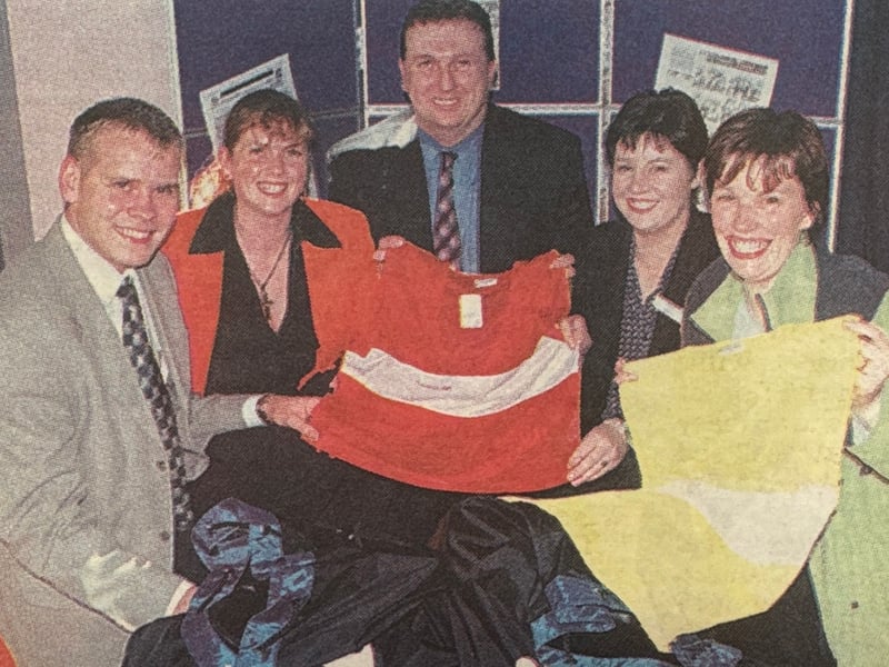 Mr David Thompson, Howard Primary School, and Mrs Millar, Newmills Primary School, collecting their football packs for the Tri-County league.