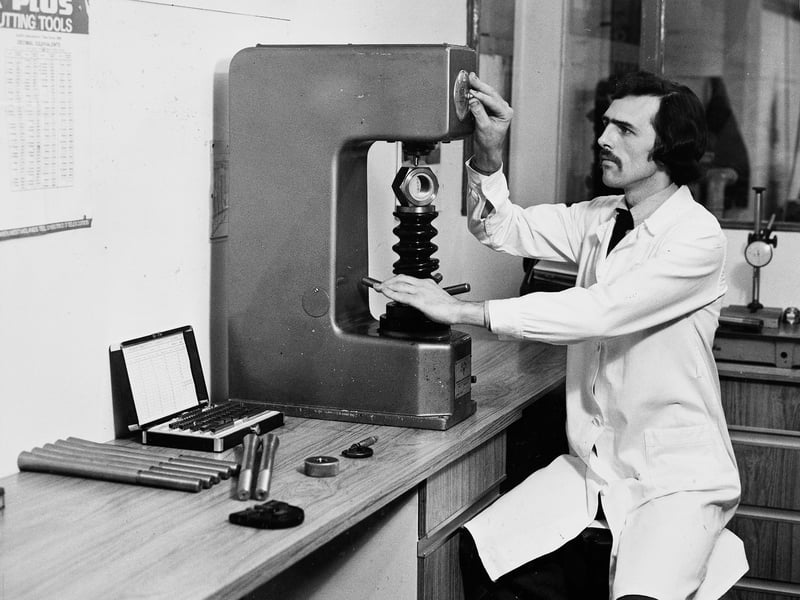 An inspector carefully operates a hardness tester in the inspection room of Fastenereliable, a Wolverhampton engineering firm carving out success in March 1982. Founded in August 1981 by experienced trade specialists Alan Russell and Brian Lee, the young venture defied the prevailing industrial downturn by manufacturing specialised nuts, bolts, and fasteners on rapid turnaround for safety-critical operations in the petro-chemical market. Do you remember the small specialist workshops and engineering outfits that powered Wolverhampton's industry in the early 1980s?