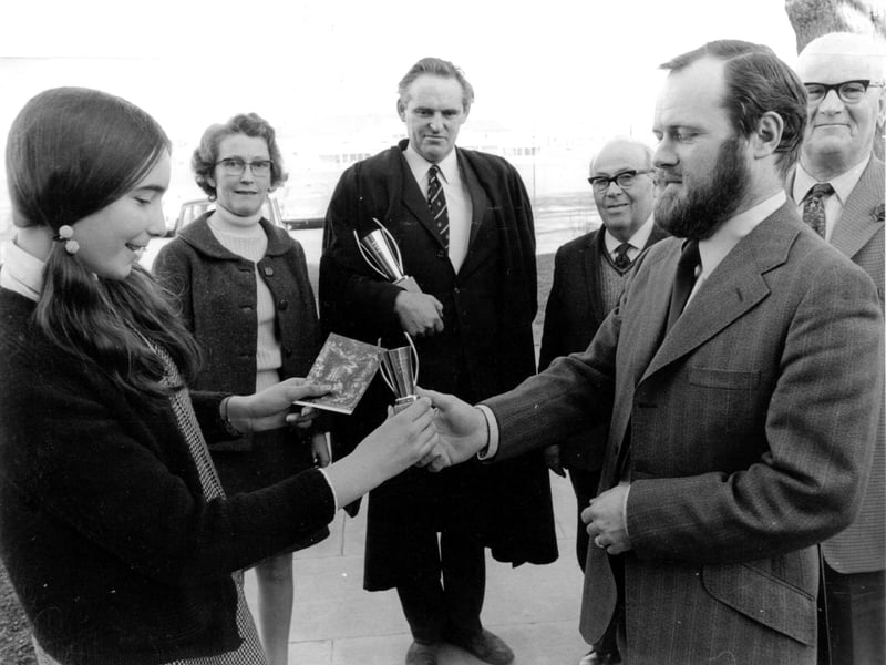 Telford Journal editor Brian Mason makes a presentation to one of the schoolgirls in the early 1970s watched by, among others, head Richard Neal.