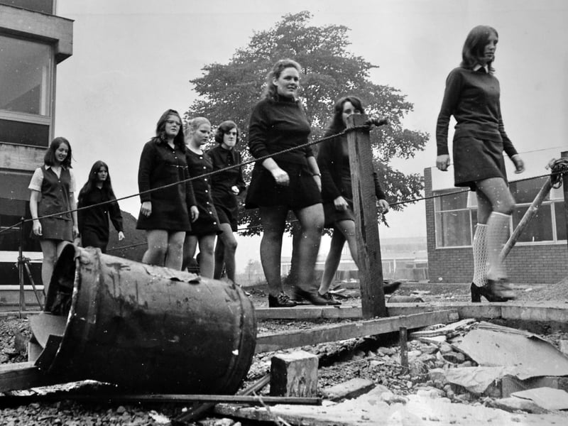 Pupils pick their way through the debris and mud in September 1971 as the school undergoes big changes. The accompanying story told how new school buildings had been due to be completed that month but work was still continuing, causing din and disruption.
