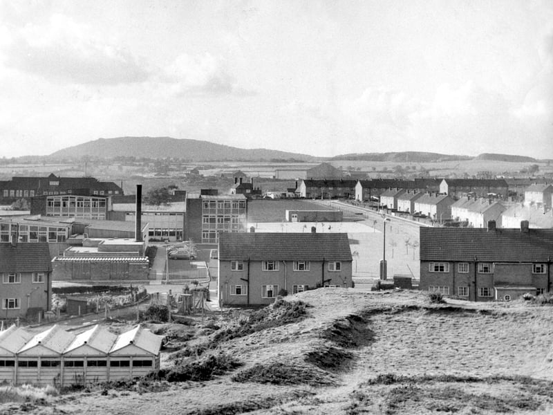 A general view of the school in October 1960, taken from one of the old pit mounds which for generations have been such a part of the Dawley landscape.
In the distance on the left is the Georgian-style Pool Hill Junior School, which burnt down in 1977. The very large building in the far distance, centre, is Horsehay Works, also known at various times as the Horsehay Company, Adamson Alliance, AB Cranes, and Adamson Butterley. It too has long gone. In the foreground are the houses on Manor Road, and Webb Crescent is on the right.