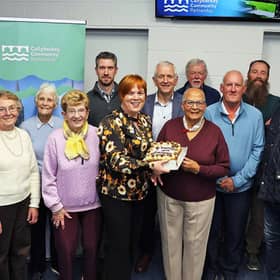 Members of Cullybackey Community Partnership celebrating their 10th birthday in the Maine Business Centre. GB4444 JK26