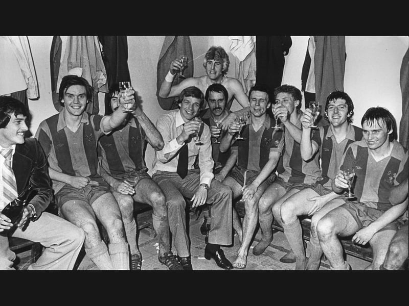 Manager Graham Turner and his jubilant Shrewsbury Town squad raise a celebratory glass on May 17, 1979, toasting a famous four-one victory over Exeter City that sealed promotion to the Second Division, joined by Bob Wardle, Jack Keay, Ian Atkins, Ken Mulhearn, Jimmy Lindsay, Jake King, Steve Cross, Tony Larkin, and David Tong. Where did you head to celebrate after the Town clinched promotion that famous Thursday night? Who was your favourite player from that legendary squad guided to glory by Graham Turner?