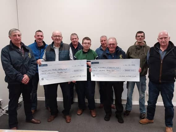 Members of Glens Vintage Club present a cheque to NI Air Ambulance