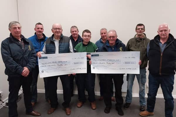 Members of Glens Vintage Club present a cheque to NI Air Ambulance