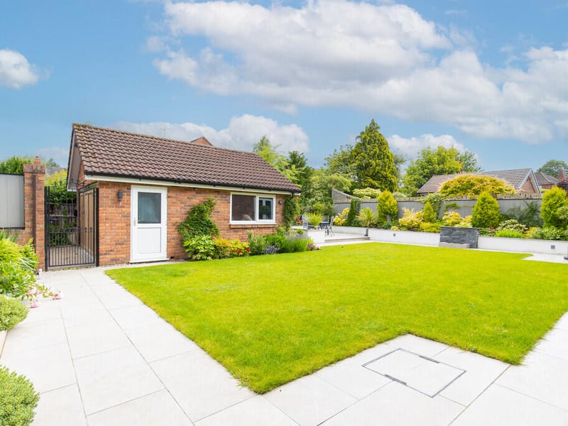 The back garden, featuring a garage