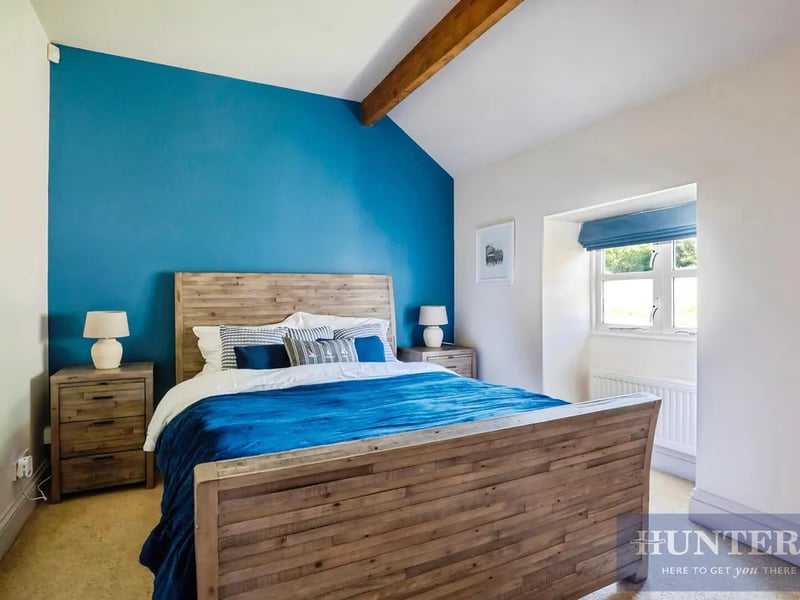 A view of another bedroom, a blank canvas bursting with light and space.