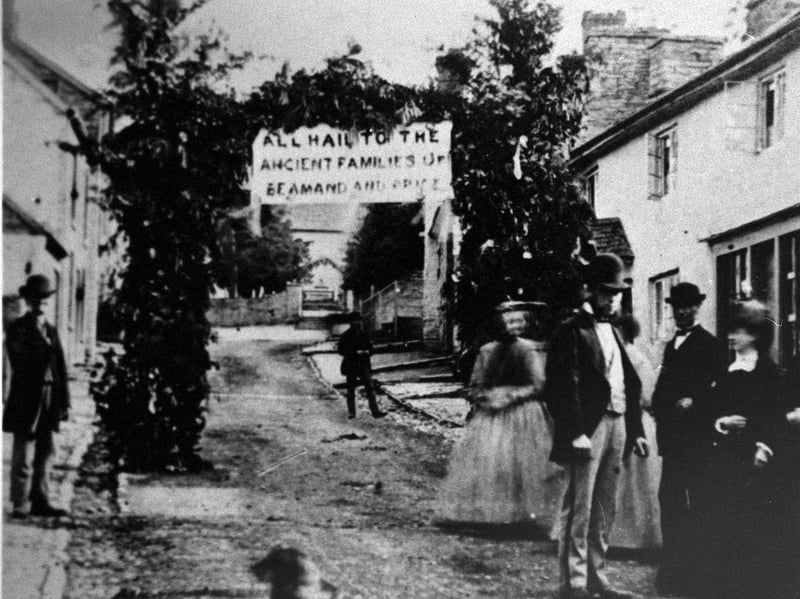 The triumphal arch says "All Hail to the Ancient Familes of Beamand and Price." After we carried this picture previously a reader wrote in to say it was the wedding of Richard Beamand and Betsy Price at Clun in 1871. The Beamand family was of Vron End, Newcastle-on-Clun, and big landowners. Richard Beamand MAY be the tall gentleman on the right. This appears not to be the actual wedding, but it is suggested it could be the family viewing the arch.