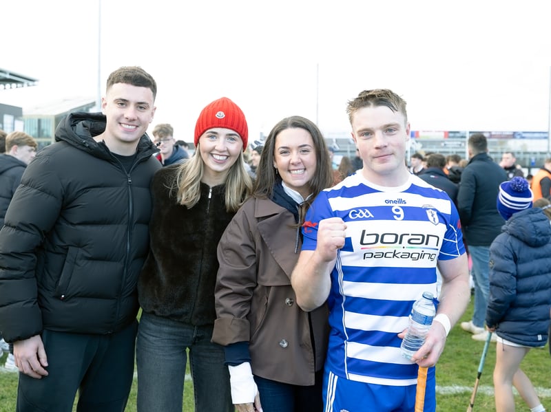 Naas midfielder Simon Leacy being congratulated by friends after the final whistle