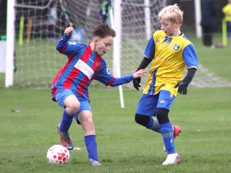 TM Sports Under-11s on the ball against Spirit of Youth Neos