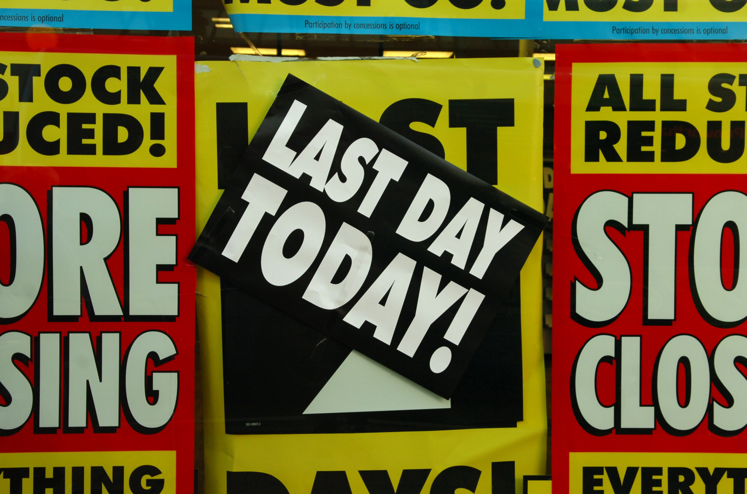 Signs in the windows on Woolworths last day in Preston.