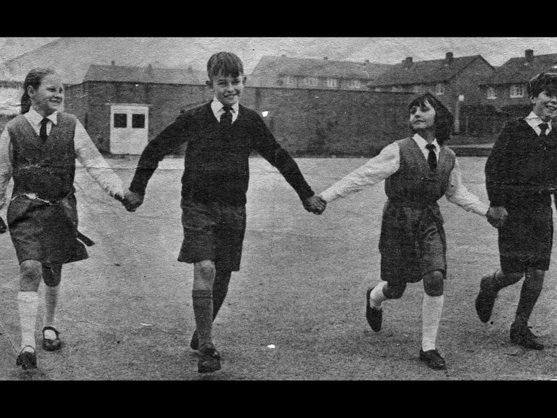 Pupils modelling the new school uniform for Phoenix School in 1965. It was chosen partly with cost in mind, doing away with expensive blazers. From left, Judith Jukes, Pete Burd, Lynn Stevens and Glyn Oliver, with the bike sheds in the background.