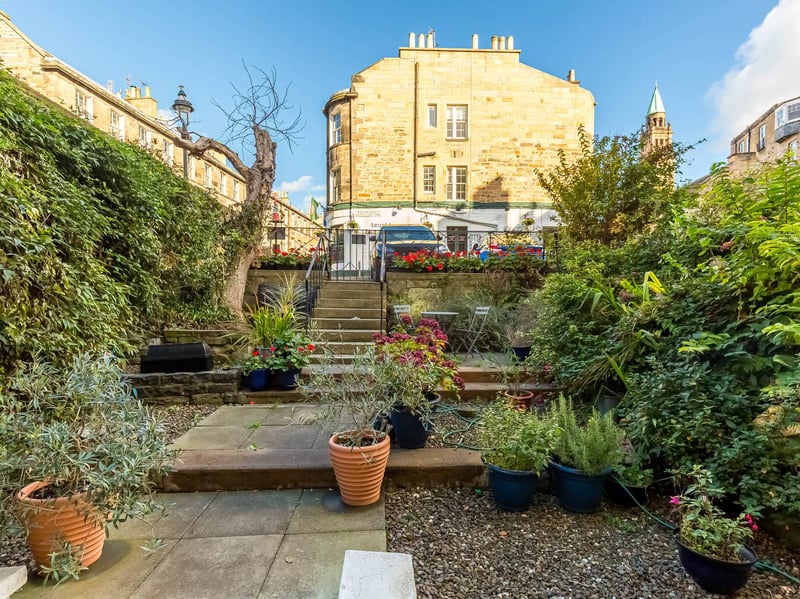 Direct access to the rear leads to this delightful terraced shared garden, featuring well-established and varied planting.