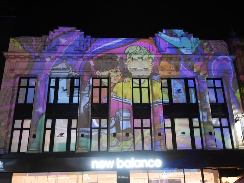 Projections on buildings on Briggate.