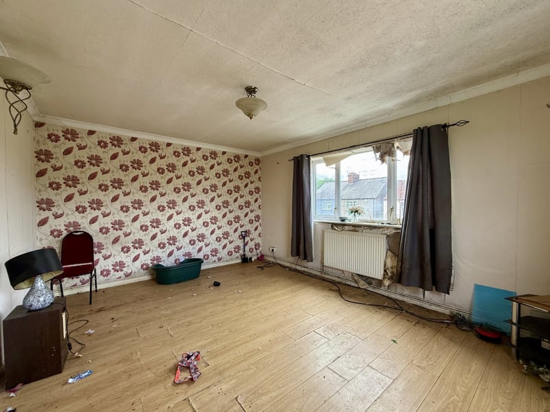There is a three-bedroom flat on the first floor.
