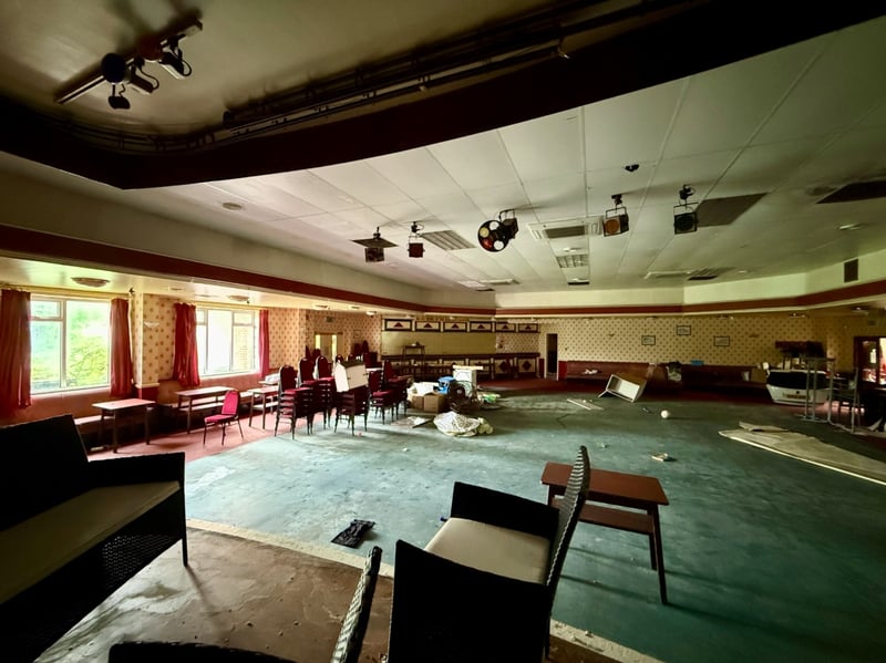 Another view of the concert room, showing the back end of a car!