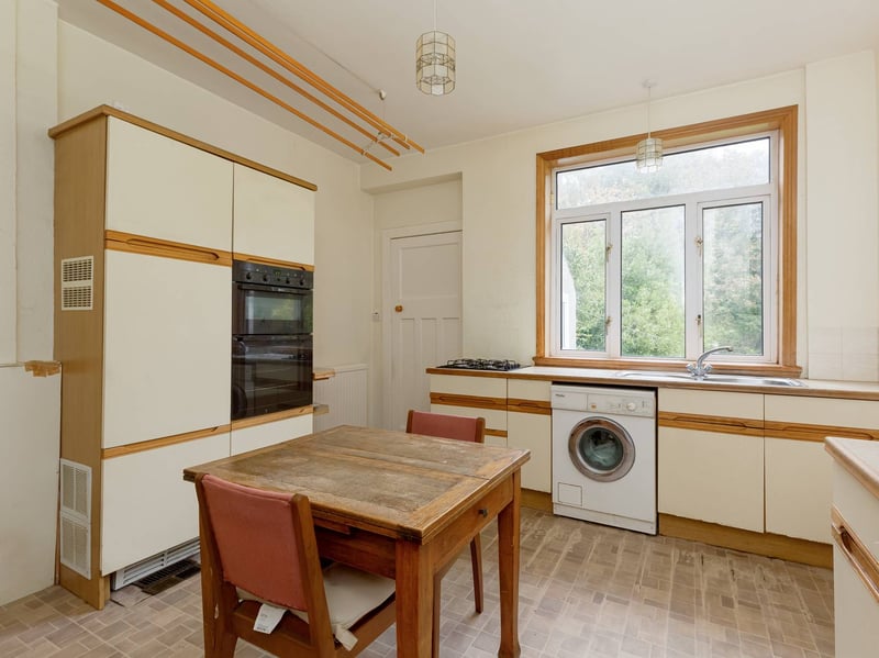 The kitchen can also be accessed directly from the hall and has a utility room adjoining. 