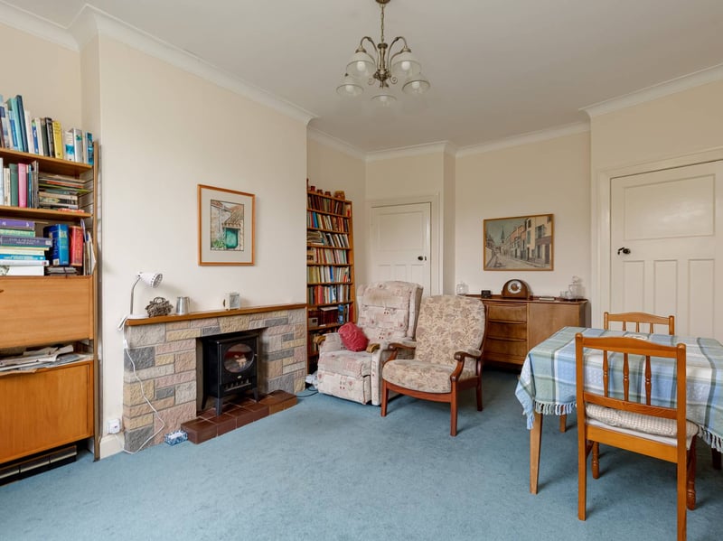 There is this formal dining room, with a door leading to the breakfasting kitchen.