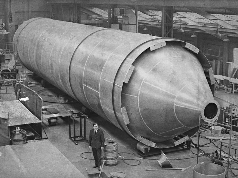 Looking more like a towering space rocket than factory equipment, an enormous aluminium silo dwarfs an onlooker at the Oxford Street works of E C Payter in Bilston in March 1974. Measuring 80 feet by 15 feet with a capacity of 13,000 cubic feet, the colossal vessel was believed to be the largest ever shop-fabricated in one piece in Britain. Built by the Alcan subsidiary to hold 160 tons of plastic granules at a major chemical plant in the North East, the record-breaking structure showcased the heavyweight skill and ambition of Black Country manufacturing. Did you work at E C Payter in Bilston or remember seeing this gigantic silo being transported through local streets in 1974?