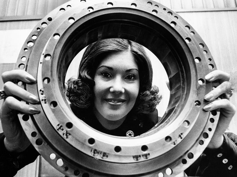 Sales team member Lynne Coyle smiles through a precision-crafted main engine bearing produced by Fafnir Bearings in June 1974. Operating plants in Wolverhampton and Hednesford, the firm played a critical role in major aerospace projects, supplying vital components for the powerful Rolls-Royce RB211 turbofan engines used in Lockheed TriStar passenger jets. The striking shot highlighted how high-precision Black Country engineering remained at the forefront of global aviation technology. Did you work at Fafnir Bearings in Wolverhampton or Hednesford back in the 1970s?   