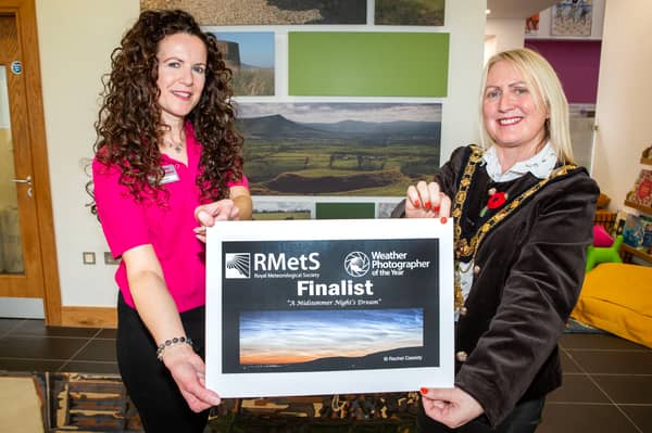 Mayor of Causeway Coast and Glens, Councillor Dawn Huggins, meets Rachel Cassidy, whose photograph of Binevenagh and Lough Foyle has earned her a place on the shortlist for the Royal Meteorological Society’s Weather Photographer of the Year 2026 competition.