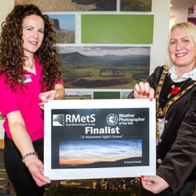 Mayor of Causeway Coast and Glens, Councillor Dawn Huggins, meets Rachel Cassidy, whose photograph of Binevenagh and Lough Foyle has earned her a place on the shortlist for the Royal Meteorological Society’s Weather Photographer of the Year 2026 competition.