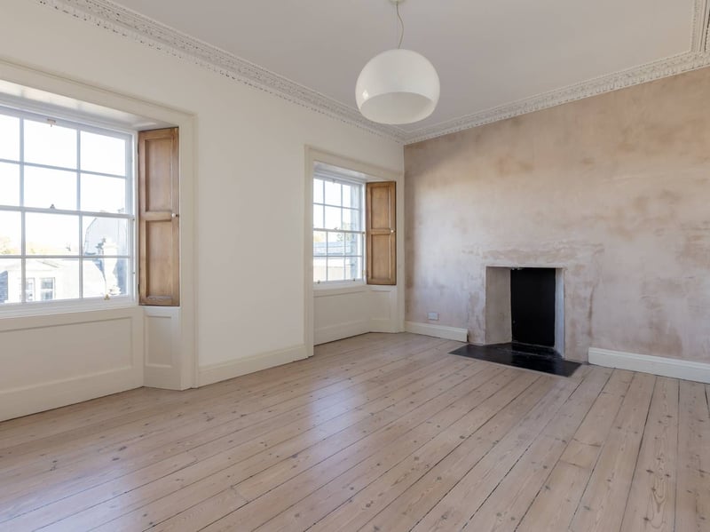 There are two good-sized double bedrooms, including this principal bedroom with twin windows to the front.