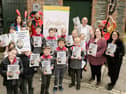 Pupils from Raphoe Central National School proudly display copies of 'Reimagining Granny’s Wonderful Chair'. The pupils worked alongside writer, Isla McGuckin, to explore Browne’s fairy tales and create their own original story, 'The Magic of Feetville', which features in the publication. Also pictured are Leas-Chathaoirleach of Donegal County Council, councillor Terry Crossan, senior executive librarian, Donna Cavanagh, executive librarian, Sinead Noonan and chairperson of the Frances Browne Literary Festival, Celine McGlynn. 