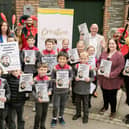 Pupils from Raphoe Central National School proudly display copies of 'Reimagining Granny’s Wonderful Chair'. The pupils worked alongside writer, Isla McGuckin, to explore Browne’s fairy tales and create their own original story, 'The Magic of Feetville', which features in the publication. Also pictured are Leas-Chathaoirleach of Donegal County Council, councillor Terry Crossan, senior executive librarian, Donna Cavanagh, executive librarian, Sinead Noonan and chairperson of the Frances Browne Literary Festival, Celine McGlynn. 