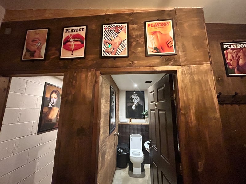 The toilets feature trendy posters and pictures