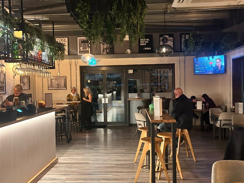 The bar features an array of seating options.