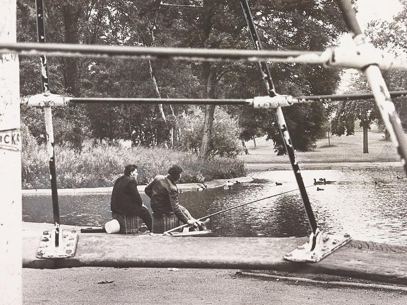 Anglers perch on their baskets at the water’s edge in Victoria Park, Tipton, enjoying calm sport once again after a dramatic life-saving mission in June 1974. Local firemen were summoned to the pool after dozens of fish were found dying on the surface due to a severe lack of oxygen in the warm, stagnant water. By pumping and aerating the lake, the fire crews successfully turned the tide, revitalising the distressed stocks and allowing enthusiastic fishermen to quickly get back to landing catches. Do you remember the fire brigade stepping in to rescue the fish at Victoria Park, or spend summer days angling by the pool in Tipton during the 1970s?