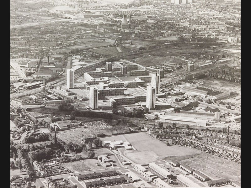 Soaring high above Wolverhampton, this striking aerial perspective from 24 July 1974 captures the newly completed Heath Town housing redevelopment in all its modern architectural ambition. Dominated by prominent tower blocks and interconnected deck-access walkways, the complex represented the cutting edge of post-war urban planning, standing in sharp contrast to the surrounding traditional streets, railway sidings, and industrial factories. Do you remember when the Heath Town flats were brand new, or did you live in one of the high-rise blocks during the 1970s?