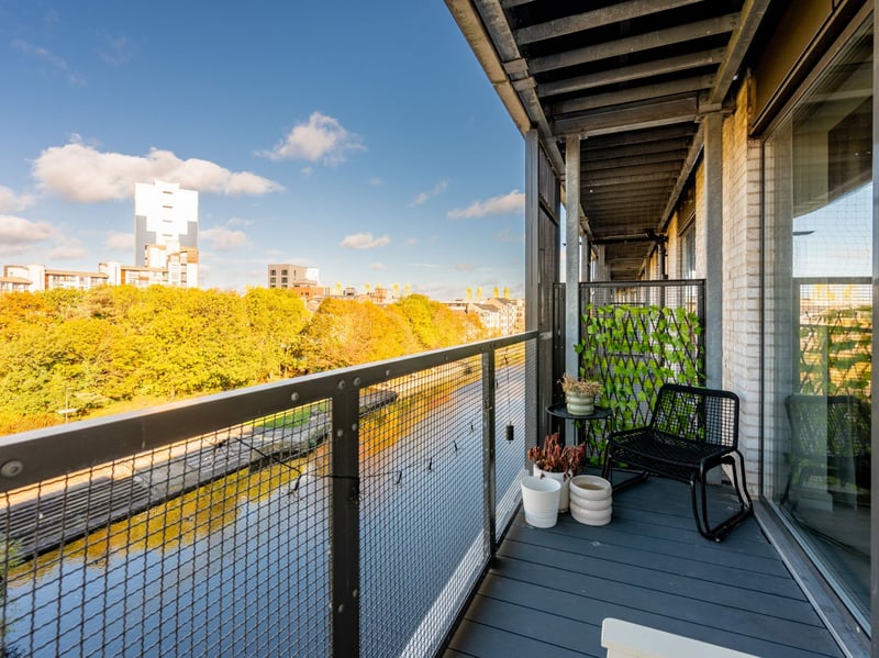 This balcony provides a peaceful setting for watching the Water of Leith roll by.