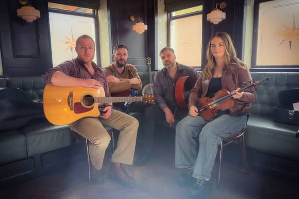 The Celtic Curse, a specially assembled group of accomplished Northern Ireland traditional musicians. Pictured, from left, are Daragh McNulty (bodhrán and guitar); Kevin Mawdsley (banjo and whistle); Stephen Butler (lead vocals); and Sinead McKenna (fiddle).