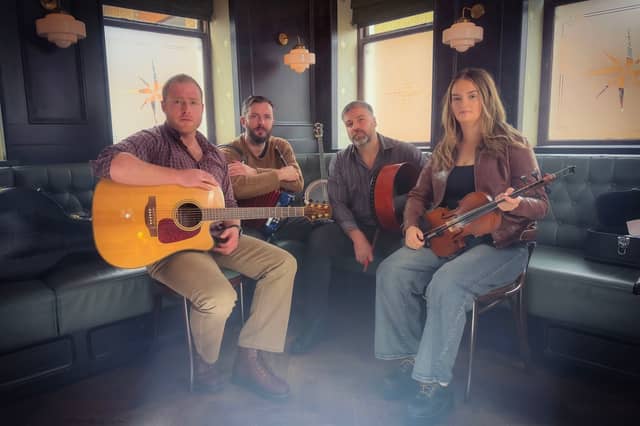 The Celtic Curse, a specially assembled group of accomplished Northern Ireland traditional musicians. Pictured, from left, are Daragh McNulty (bodhrán and guitar); Kevin Mawdsley (banjo and whistle); Stephen Butler (lead vocals); and Sinead McKenna (fiddle).