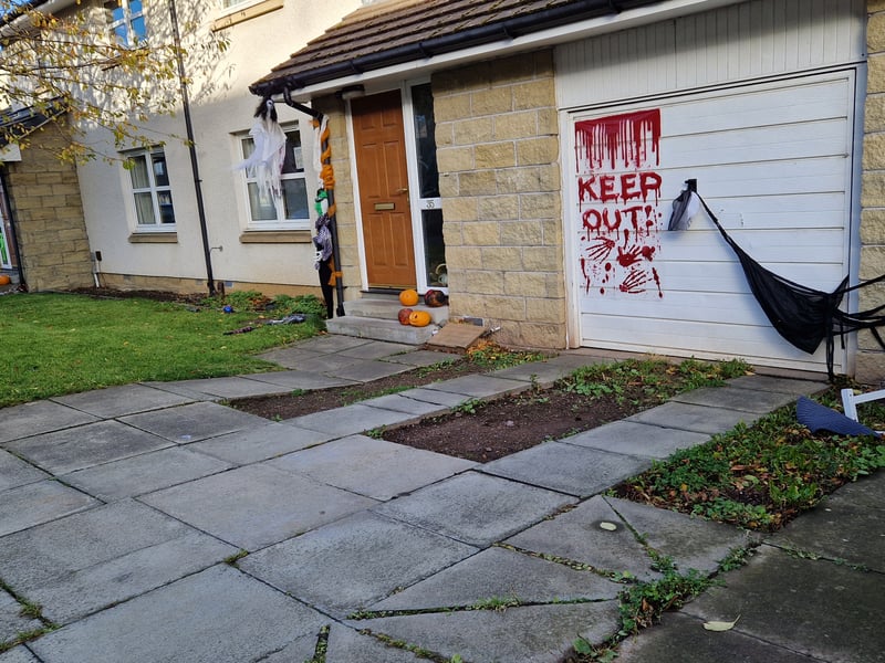 This Redhall home has a scary warning on the garage doors for guisers this Halloween.