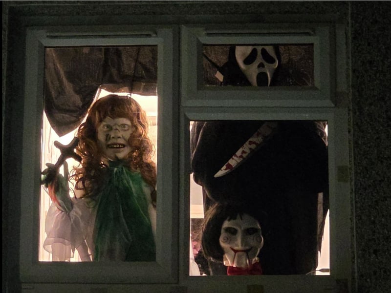 Scary faces at the window of this house.