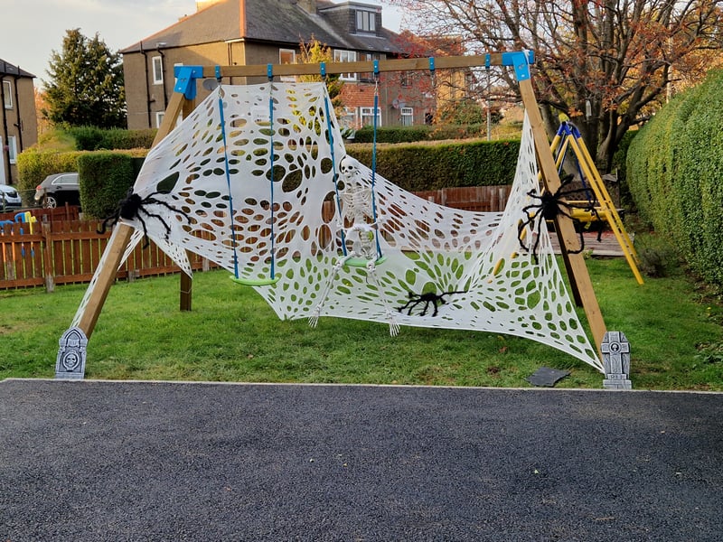 This Carrick Knowe garden's swings have been covered in a spooky spiders' web for Halloween.