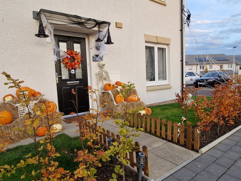With pumpkins galore, skeletons and a spider crawling down the side this West Craigs home is ready for Halloween.