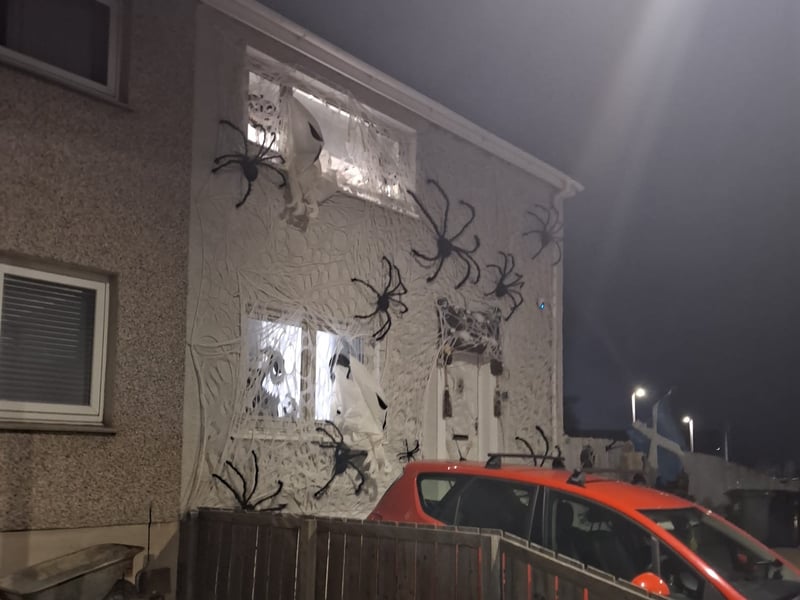 This house in Danderhall is absolutely covered in huge spiders for Halloween.